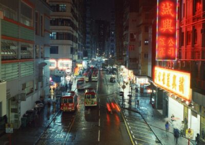 Wet city street at night with neon signs